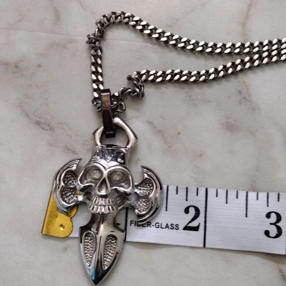 Chisel stainless steel skull pendant and chain necklace.